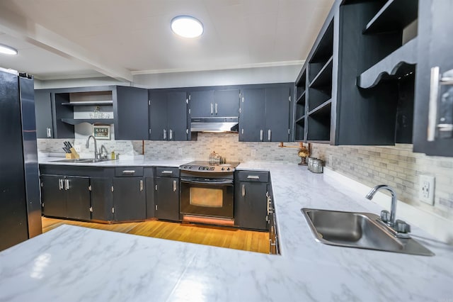 kitchen featuring open shelves, under cabinet range hood, black range with electric cooktop, and a sink