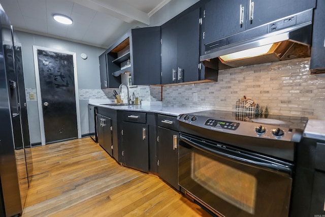 kitchen featuring black appliances, under cabinet range hood, open shelves, a sink, and light countertops