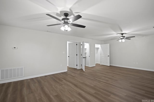 unfurnished living room with wood finished floors, a ceiling fan, visible vents, and baseboards