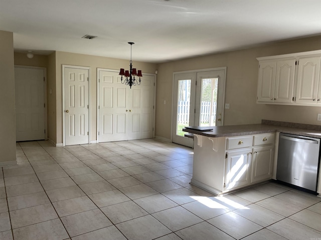 kitchen with visible vents, dark countertops, a peninsula, light tile patterned floors, and dishwasher