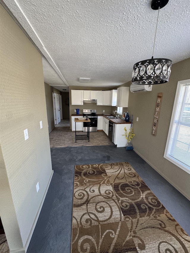 kitchen featuring dishwasher, electric stove, white cabinetry, and a textured ceiling