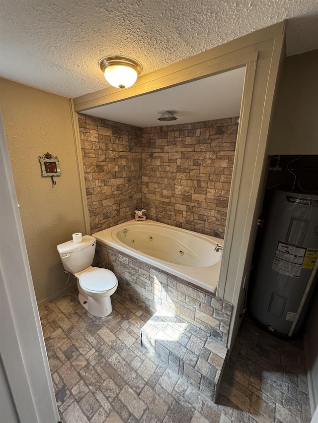 full bathroom with baseboards, toilet, water heater, a textured wall, and a textured ceiling