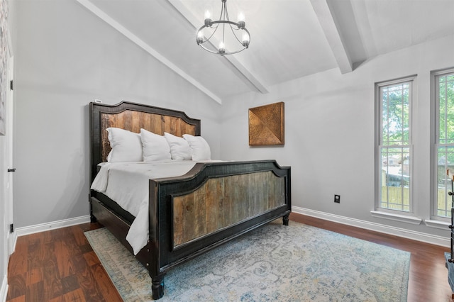 bedroom featuring lofted ceiling with beams, a notable chandelier, wood finished floors, and baseboards