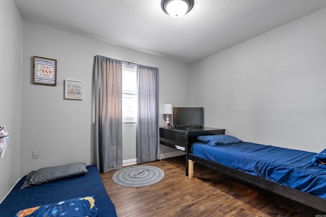 bedroom featuring wood finished floors