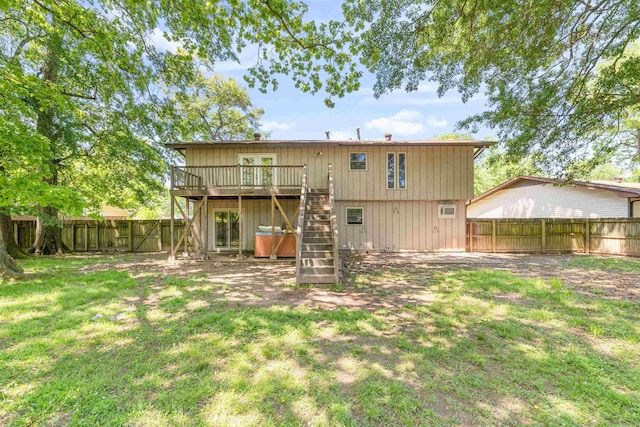 back of house featuring a yard, stairway, a fenced backyard, and a deck