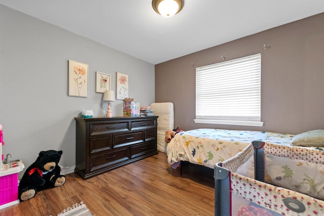 102 Oxford Cv, Jacksonville, AR 72076 - bedroom with baseboards and light wood-type flooring