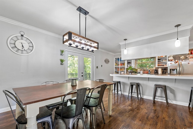 dining area featuring baseboards, dark wood-type flooring, and ornamental molding