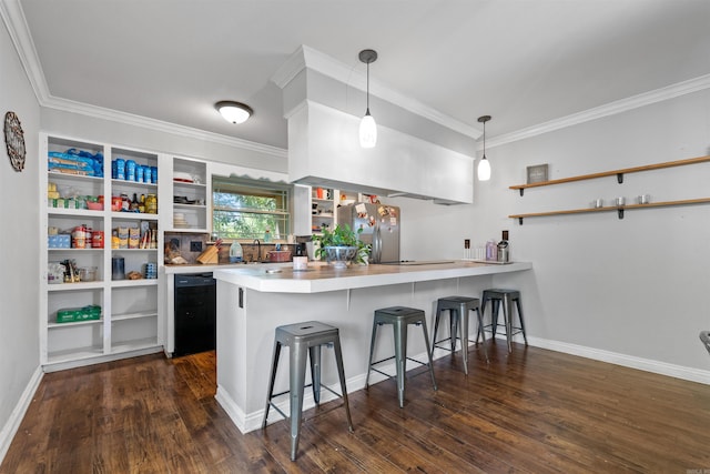 kitchen with dishwasher, open shelves, a kitchen breakfast bar, and a peninsula