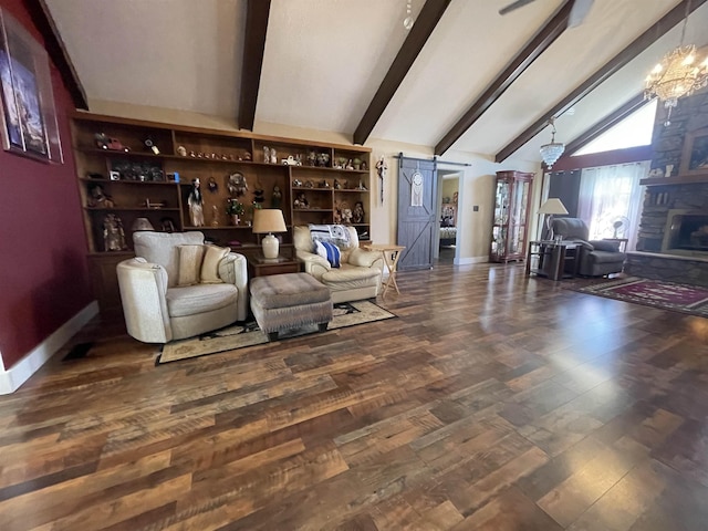 living area featuring decorative columns, wood finished floors, baseboards, and vaulted ceiling with beams