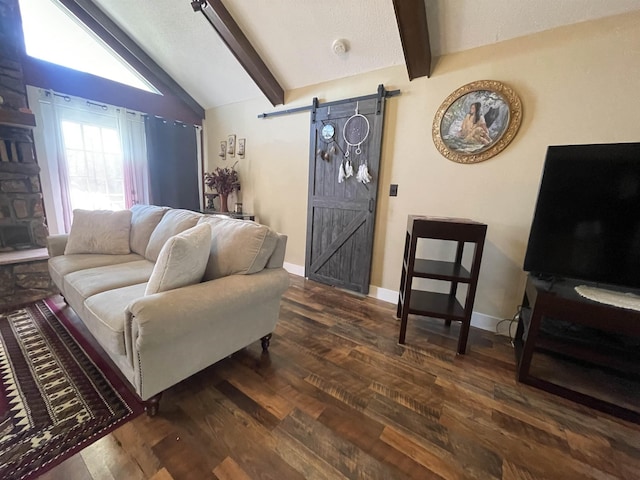 living area featuring baseboards, vaulted ceiling with beams, a barn door, and wood finished floors