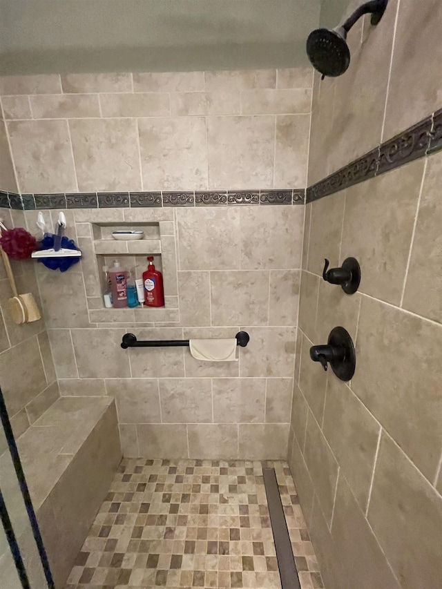 full bathroom with tiled shower