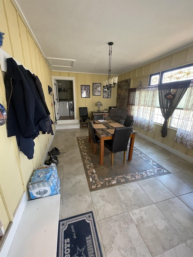 dining room with light tile patterned floors and baseboards