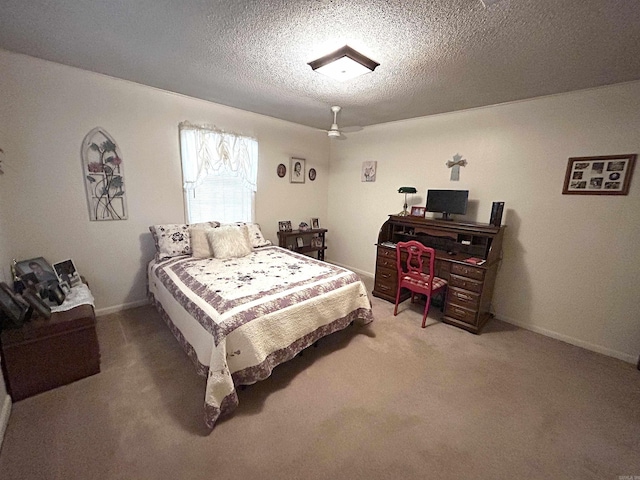 bedroom featuring a textured ceiling, baseboards, and light carpet