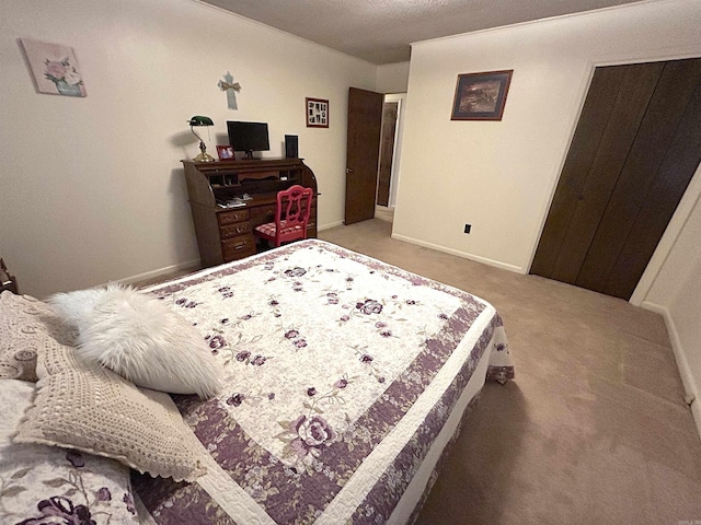 carpeted bedroom with baseboards