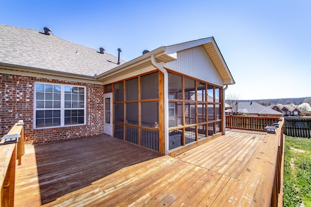 wooden terrace with a sunroom