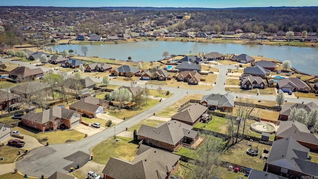 birds eye view of property with a residential view and a water view