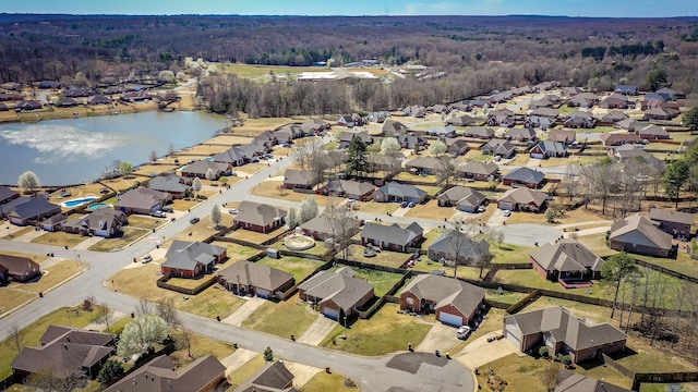 bird's eye view with a residential view and a water view