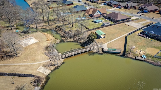 drone / aerial view with a residential view and a water view