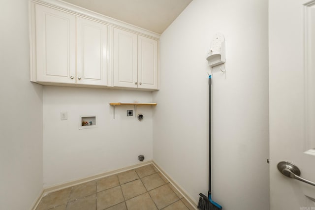 clothes washing area featuring baseboards, cabinet space, hookup for an electric dryer, and hookup for a washing machine