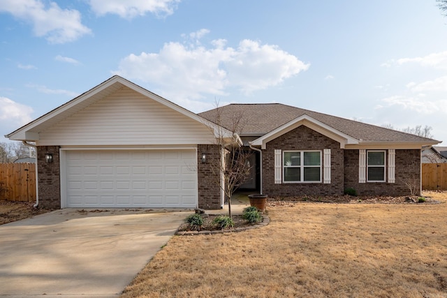 ranch-style home with brick siding, an attached garage, concrete driveway, and fence