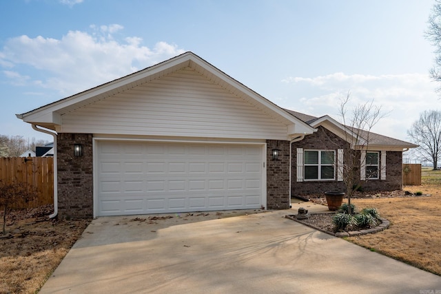 ranch-style home with brick siding, concrete driveway, a garage, and fence