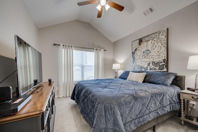 bedroom with visible vents, light colored carpet, ceiling fan, and vaulted ceiling