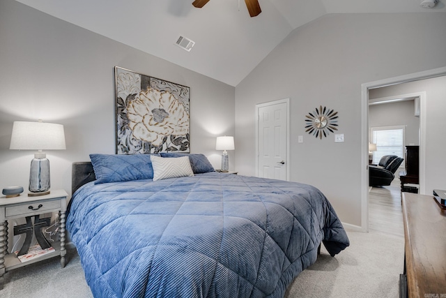 carpeted bedroom with visible vents, lofted ceiling, baseboards, and ceiling fan