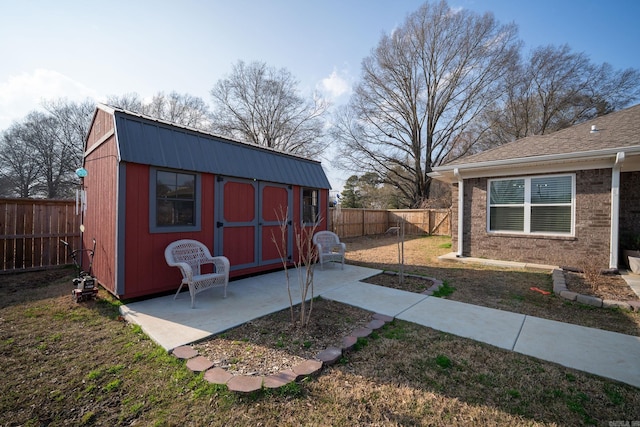 view of shed with a fenced backyard