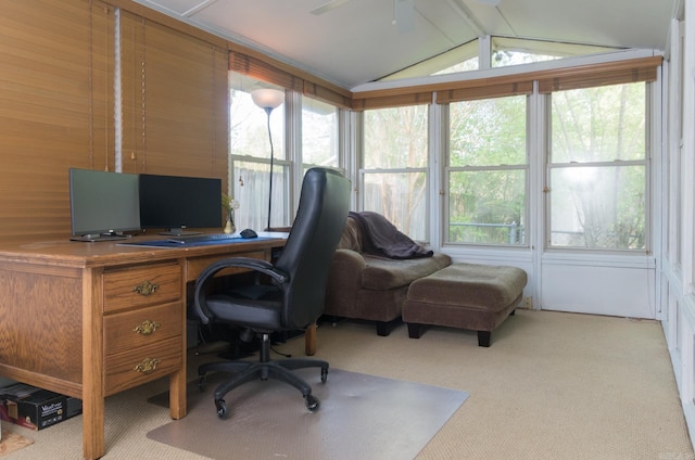 office space with lofted ceiling with beams, a ceiling fan, and light carpet