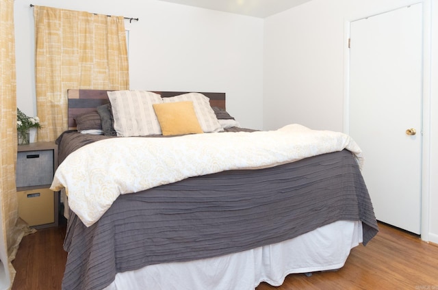 bedroom featuring wood finished floors