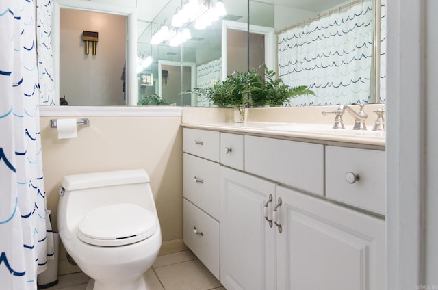 bathroom featuring tile patterned flooring, toilet, vanity, and a shower with curtain