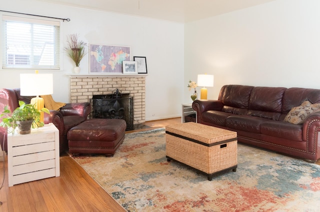 living room with wood finished floors and a fireplace