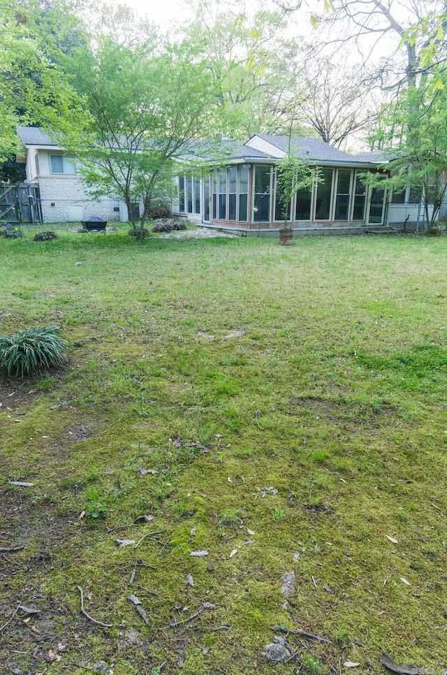 view of yard featuring a sunroom