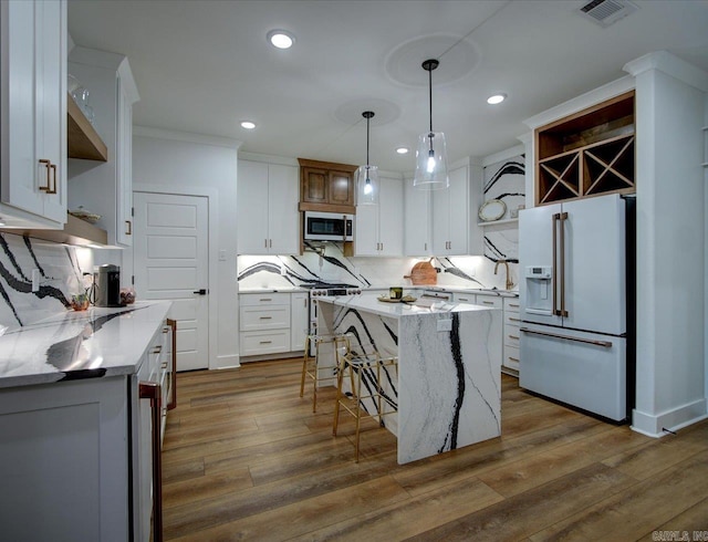 kitchen featuring visible vents, dark wood finished floors, stainless steel appliances, white cabinetry, and open shelves