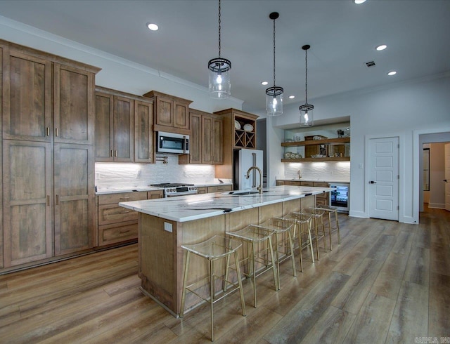 kitchen featuring crown molding, beverage cooler, light wood-type flooring, appliances with stainless steel finishes, and open shelves