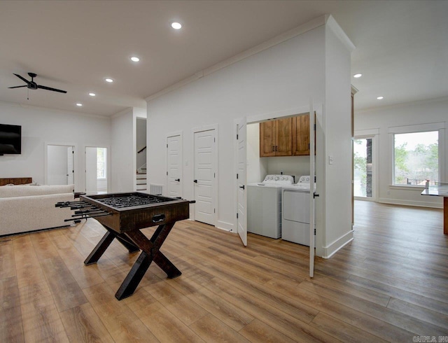 game room featuring recessed lighting, independent washer and dryer, ornamental molding, and light wood finished floors