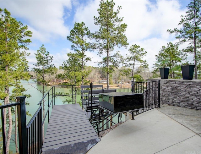 view of patio / terrace featuring a water view