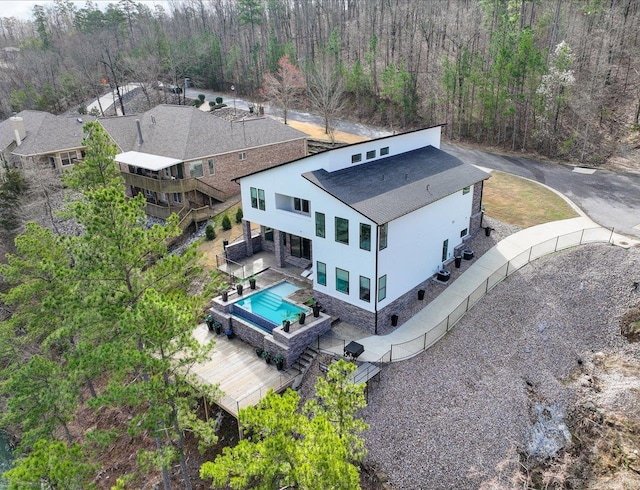 bird's eye view featuring a wooded view