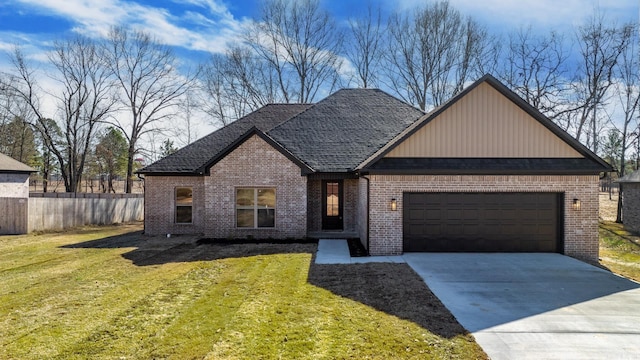 view of front of property with a front yard, an attached garage, brick siding, and driveway