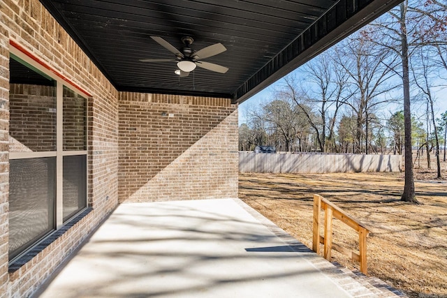 view of patio / terrace featuring a ceiling fan and fence