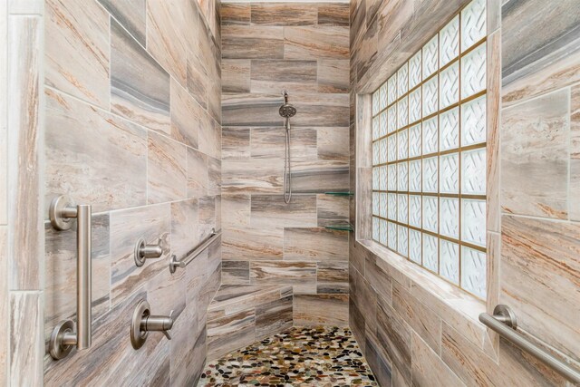 full bathroom with tiled shower