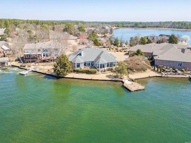 birds eye view of property with a water view and a residential view