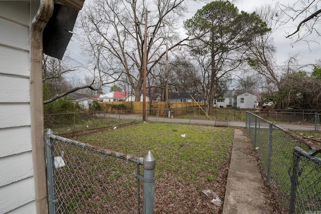 view of yard featuring a residential view and fence