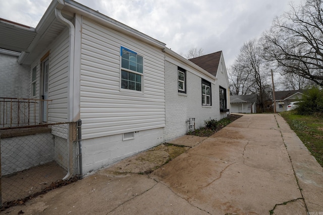 view of side of home featuring crawl space