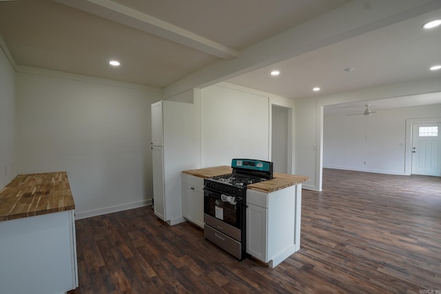 kitchen featuring wood counters, gas range, dark wood-style flooring, and freestanding refrigerator