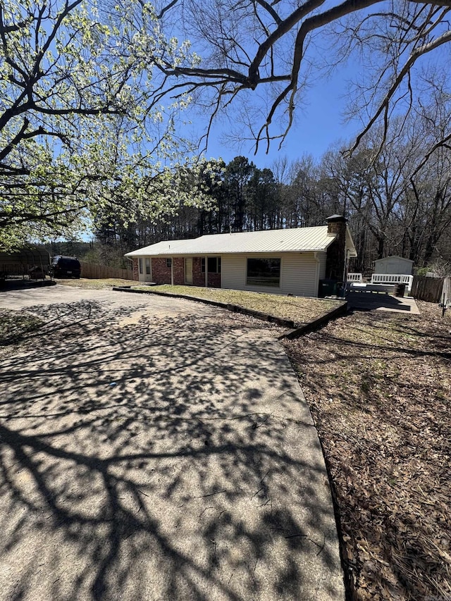 exterior space featuring metal roof