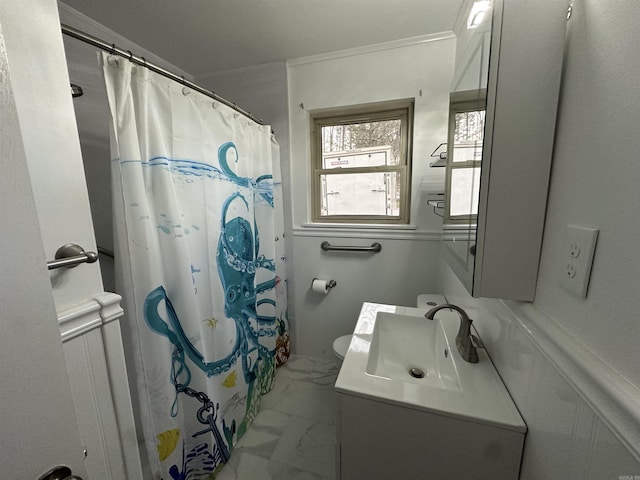 full bath with crown molding, toilet, a shower with shower curtain, marble finish floor, and vanity