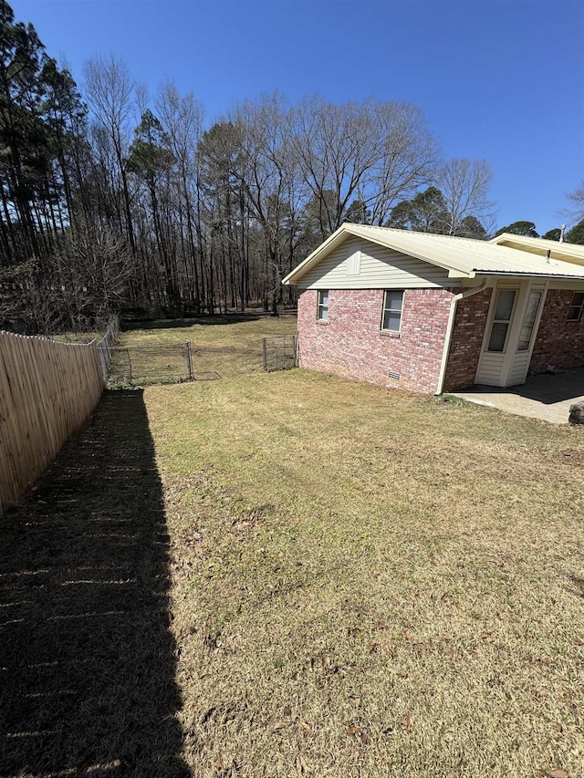 view of yard featuring a patio area and a fenced backyard