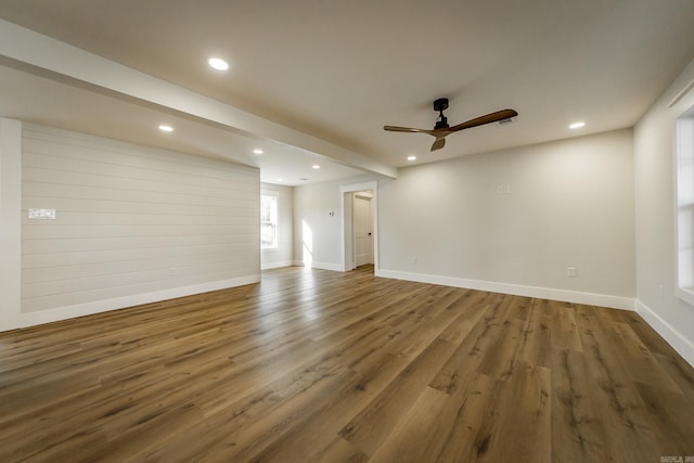 empty room featuring recessed lighting, baseboards, ceiling fan, and wood finished floors