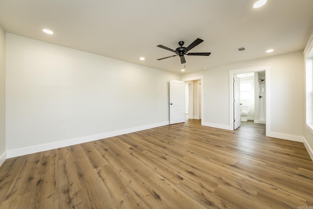 unfurnished bedroom featuring visible vents, recessed lighting, baseboards, and wood finished floors